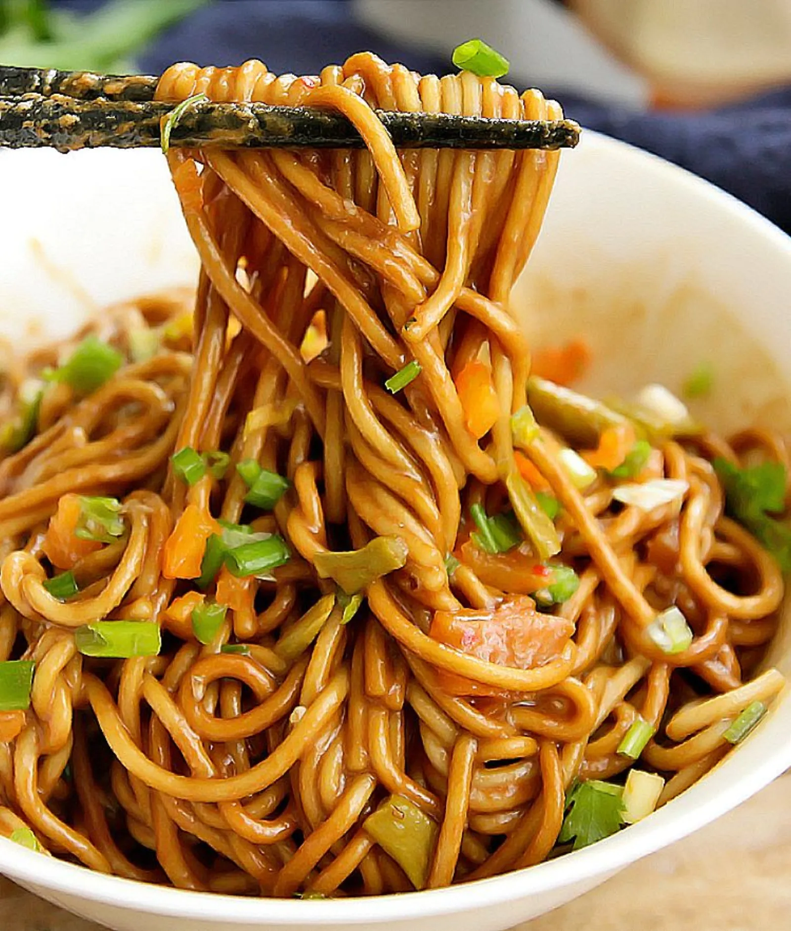 Wuhan hot dry noodles (reganmian) close-up with sesame paste coating every strand
