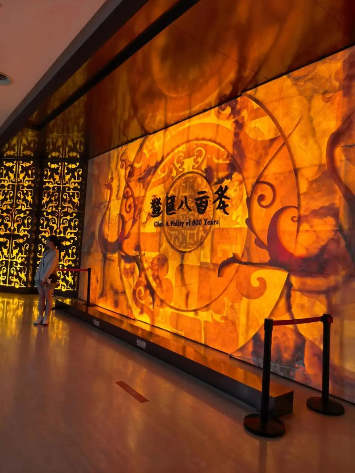 Chu Culture gallery inside Hubei Provincial Museum — lacquerware, bronze vessels, and wooden figurines on display