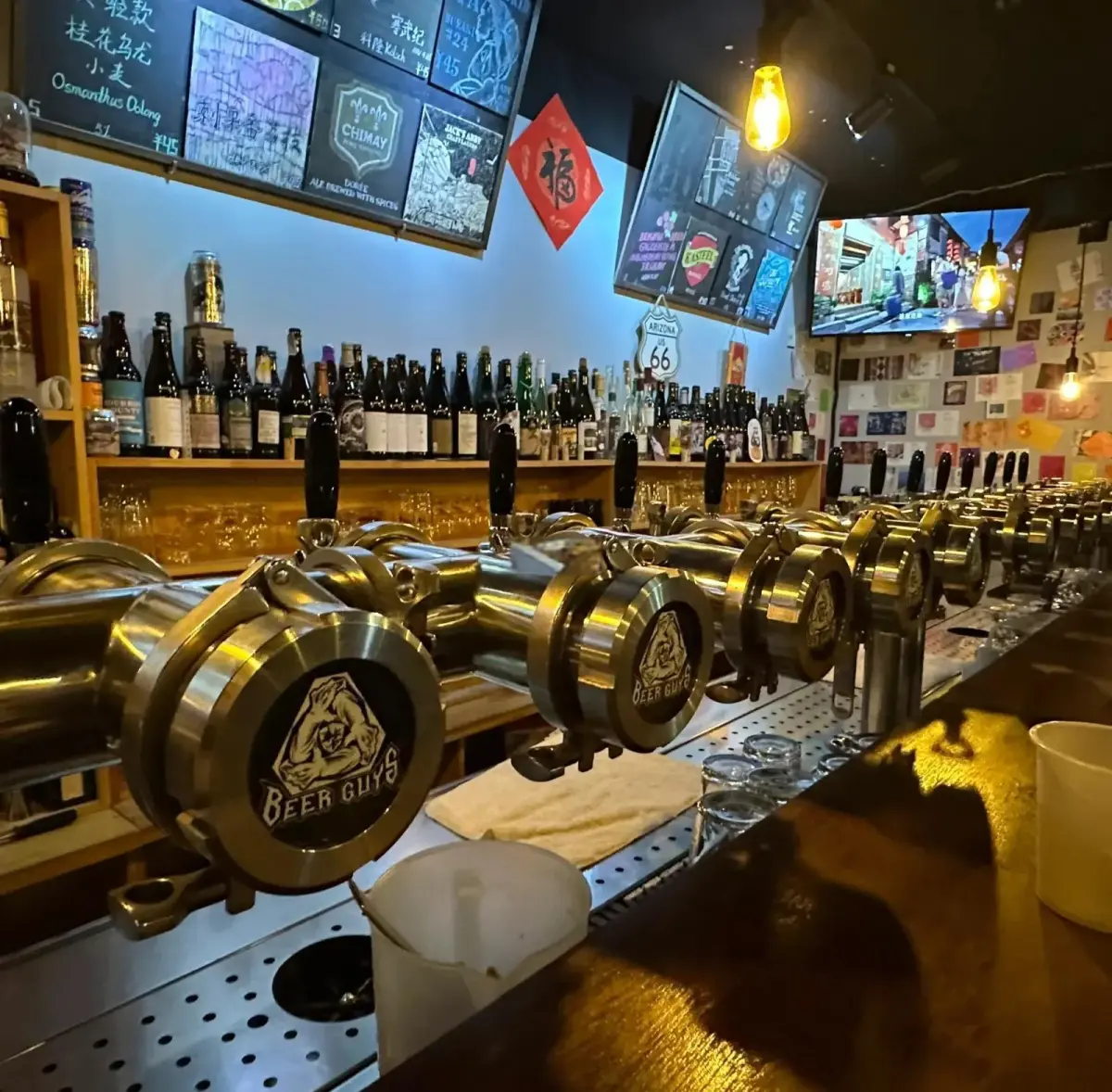 Craft beer bar interior with multiple tap handles and a chalkboard menu in Wuhan