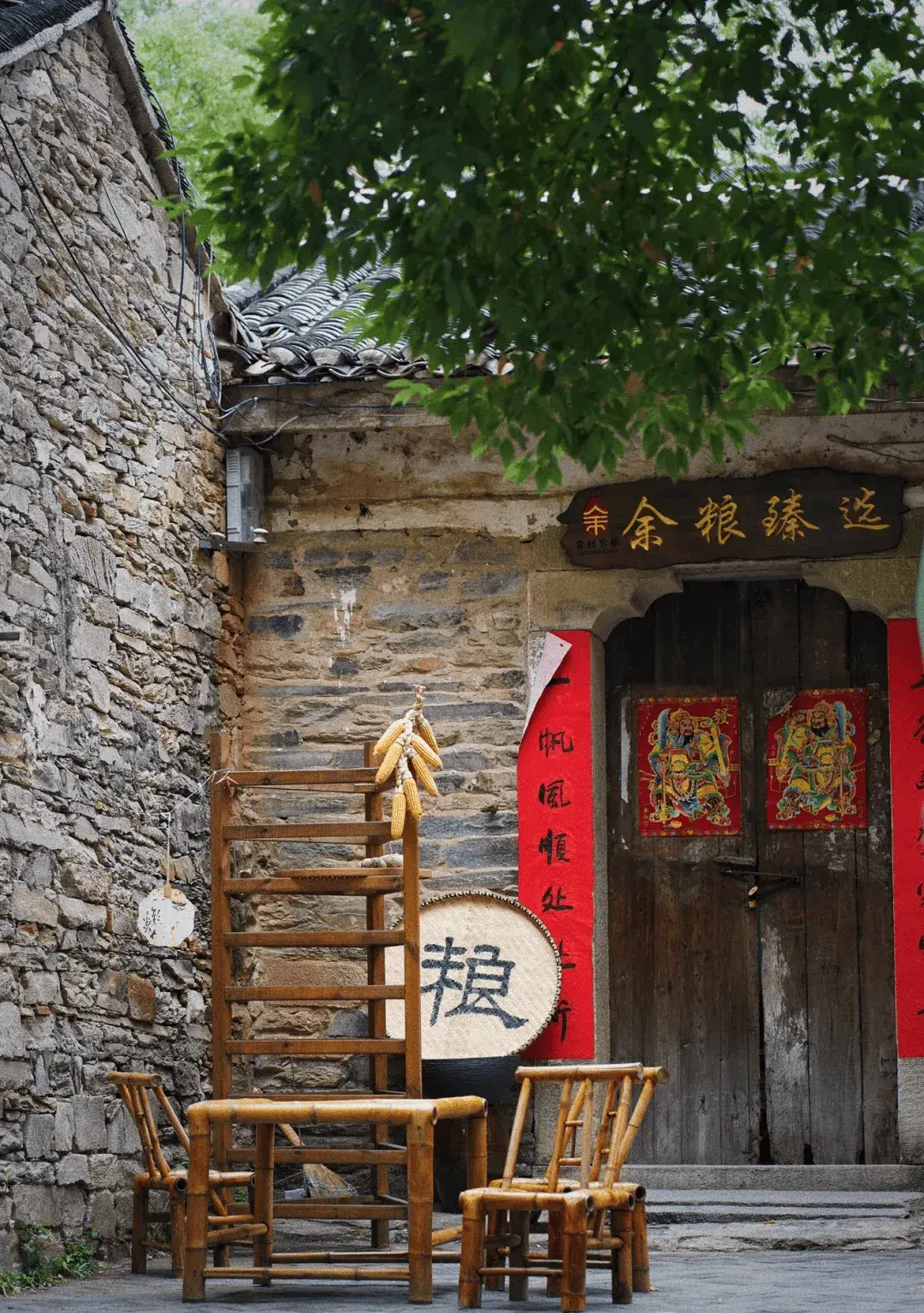 Duyuwan ancient village in Huangpi near Wuhan, Ming Dynasty stone houses with gray tile roofs and farmland beyond