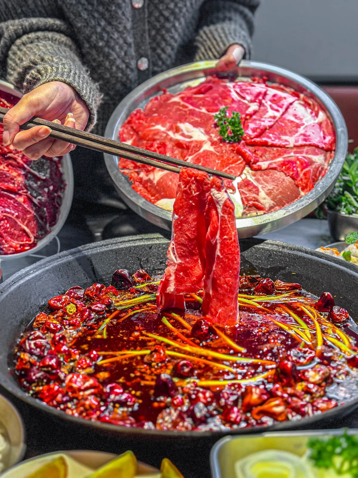 A Wuhan hot pot restaurant or lively dining scene where animated conversation is the norm, showing the social context in which these colorful expressions come to life