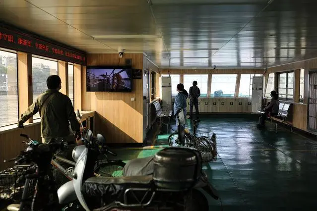 Wuhan ferry port dock entrance with metal ramp and old ticket booth showing the no-frills boarding area