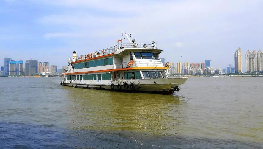 View from the Wuhan ferry boat showing the Yangtze River waterfront and city buildings from water level