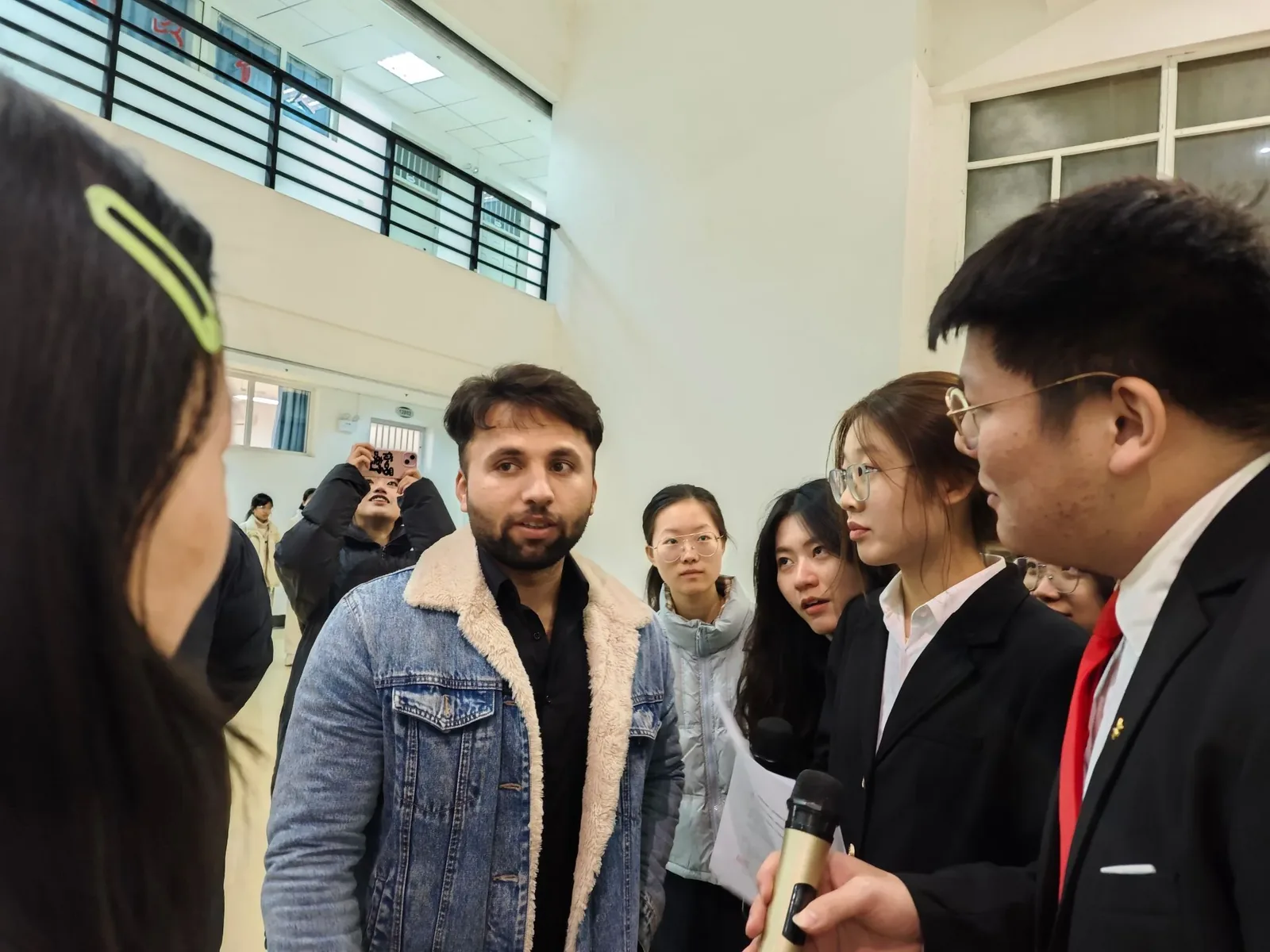 University campus in Wuhan showing international students walking between buildings, representing the large student population that forms the backbone of the city's foreign community