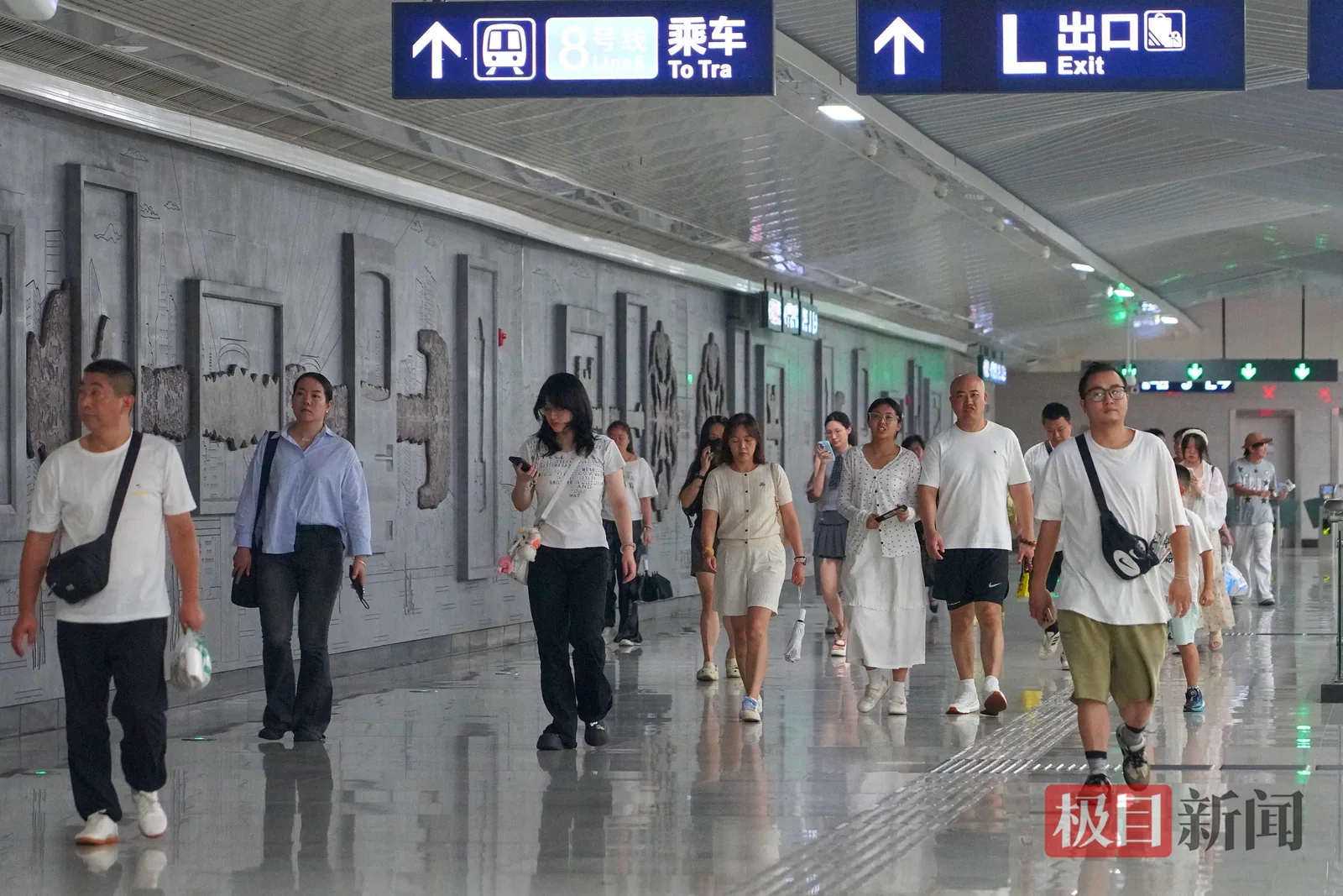 Interior of a Wuhan Metro train car showing passengers during a commute, capturing the energy and density of daily metro travel in the city