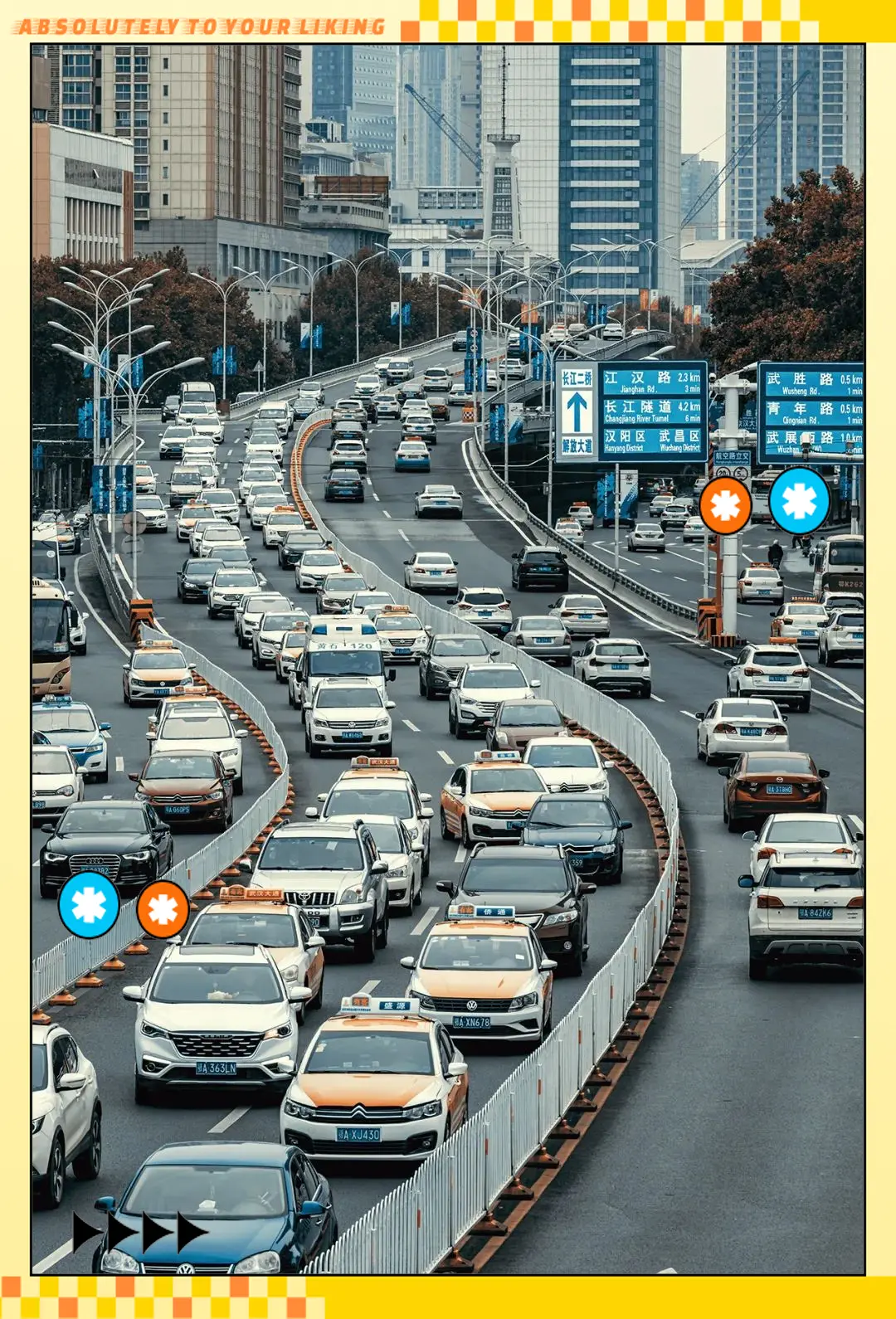 Wuhan street traffic with e-bikes, taxis, and pedestrians at a busy intersection
