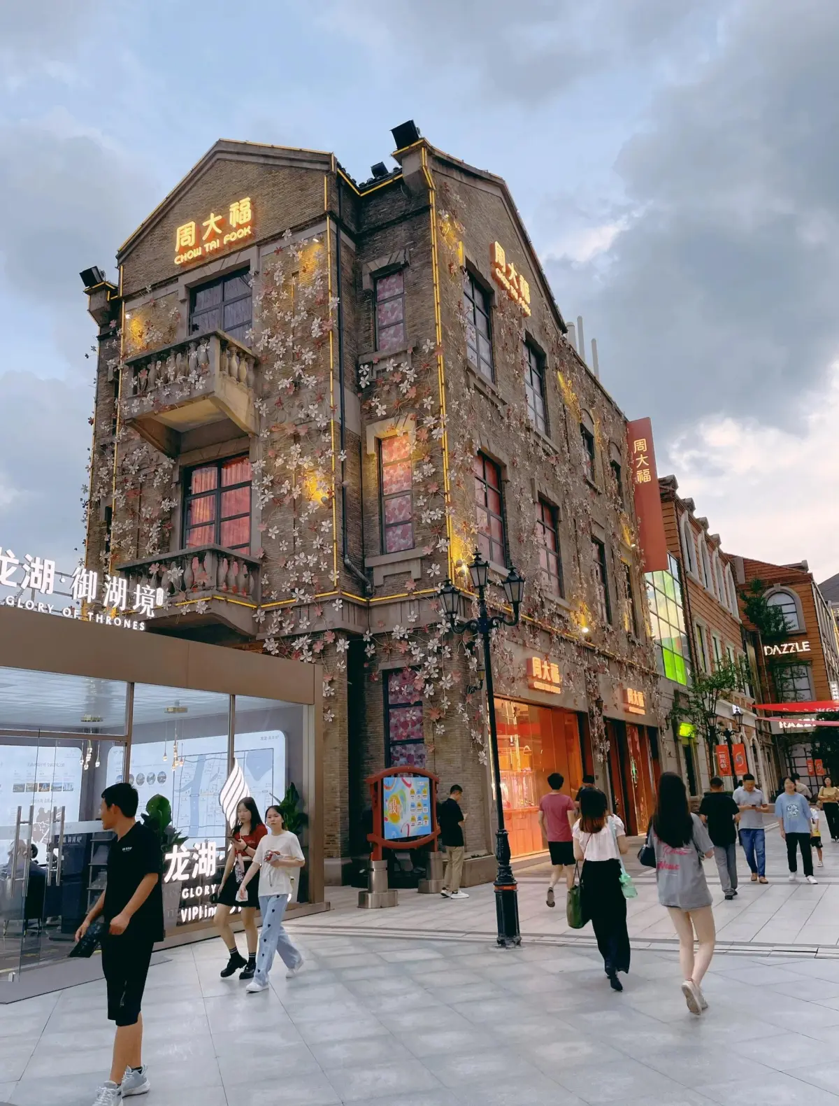 Chuhe Han Street pedestrian shopping promenade along a canal in Wuhan with modern architecture and water views