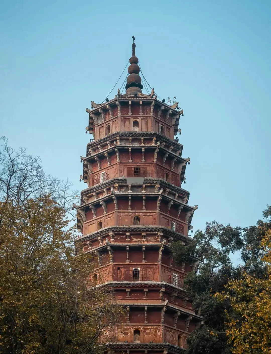 Hongshan Pagoda at Baotong Temple in Wuchang, a seven-story octagonal brick pagoda from the Yuan Dynasty surrounded by old cypress trees