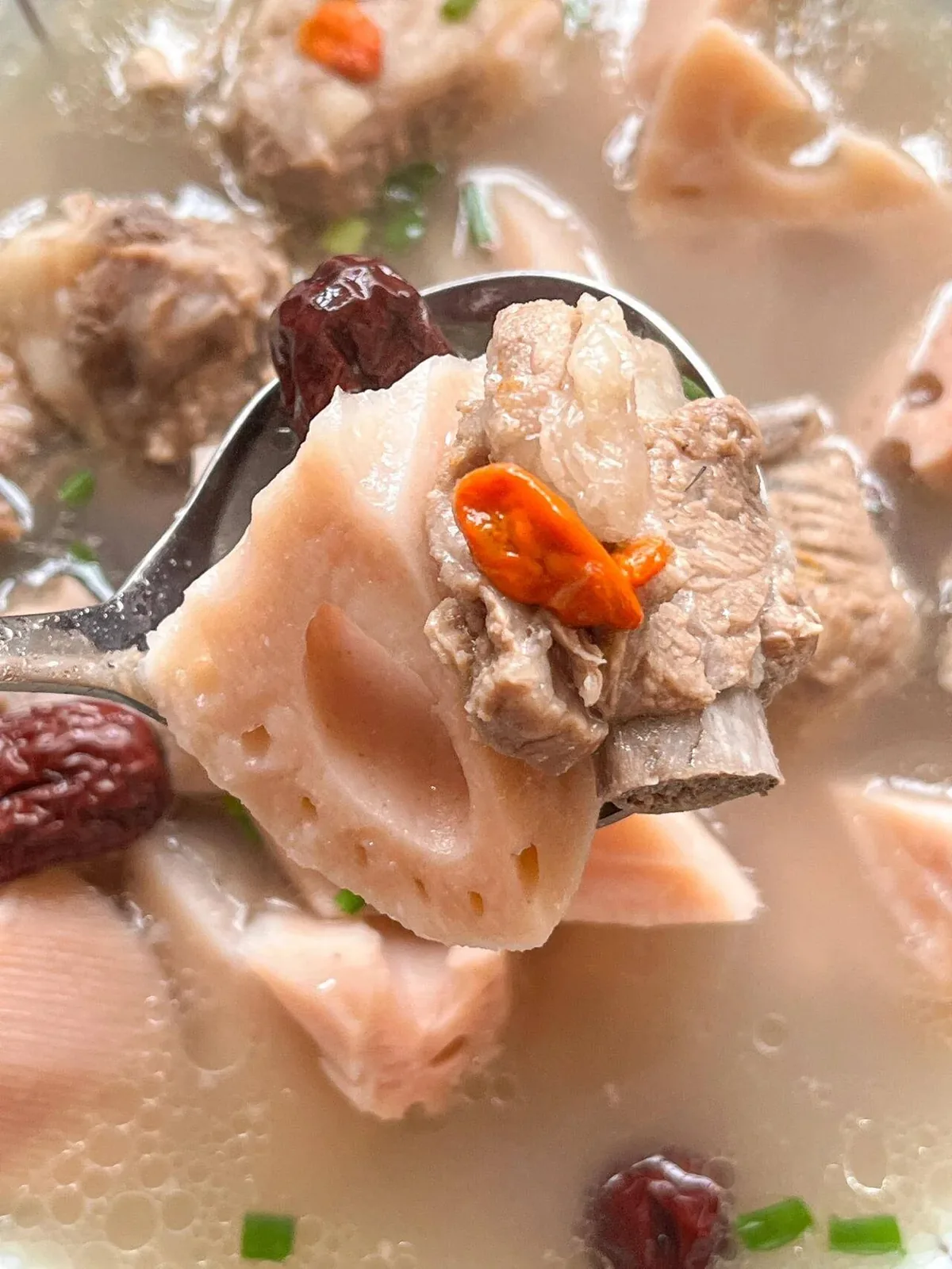 Steam rising from a Wuhan winter meal, hot pot boiling at a family table, with condensation on surrounding windows from the indoor cooking warmth